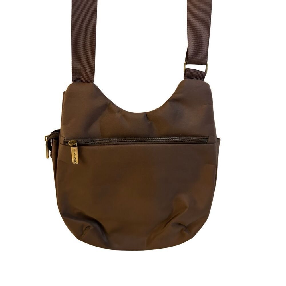 Travelon criss‎ cross RDIF brown with animal print lined 10x12”multi compartment